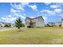 Residential corner lot featuring a well-manicured lawn, two-story home, and sidewalks along the neighborhood street at 4630 Bent Green Ln, Monroe, NC 28112