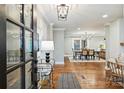 Elegant entryway featuring hardwood floors, stylish decor, and an open view of the dining area at 500 Lansdowne Rd, Charlotte, NC 28270