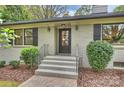 Inviting front entrance featuring a stylish front door, brick steps, and fresh landscaping at 500 Lansdowne Rd, Charlotte, NC 28270