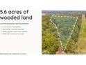 5.6 acres of wooded land with the lot outlined in white including information about land development and foundations at 10835A Wildlife Rd, Charlotte, NC 28278