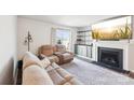 Comfortable living room with a fireplace, TV, and sliding glass door to back patio at 2027 Redstone Dr, York, SC 29745