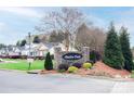 The Meadow Creek neighborhood entrance sign is made of stone, surrounded by lush landscaping at 222 Baldwin Ct, Rock Hill, SC 29730