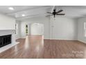 Spacious living room with a cozy fireplace and hardwood floors throughout at 2390 Old Wilkesboro Rd, Statesville, NC 28625
