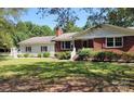 Beautifully maintained front yard with lush grass and mature landscaping enhances this home's appeal at 275 Ned Williams Rd, Kershaw, SC 29067