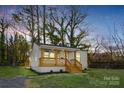 Charming single-story home featuring a welcoming front porch and beautifully landscaped front yard at 530 S Trenton St, Gastonia, NC 28052