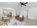 Bright living room with wood floors, neutral decor, and comfortable seating arrangement at 530 S Trenton St, Gastonia, NC 28052