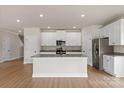 Modern kitchen with stainless steel appliances, granite countertops, and a center island at 5716 Skinny Dr, Charlotte, NC 28215