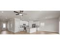 Open-concept space featuring hardwood floors, recessed lighting, and a modern kitchen with stainless steel appliances at 5716 Skinny Dr, Charlotte, NC 28215