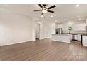 Open floorplan living room and kitchen showcasing modern finishes and ample natural light at 7110 Jerimoth Dr, Charlotte, NC 28215
