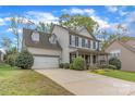Beautiful two-story home with a well-maintained lawn, attached garage and inviting curb appeal at 7215 Meyer Rd, Fort Mill, SC 29715