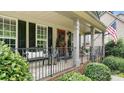 Inviting front porch with decorative railings and porch furniture create an appealing outdoor space at 7215 Meyer Rd, Fort Mill, SC 29715