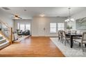 Spacious living room featuring hardwood floors, large windows, and an open floor plan at 722 Sandy Green Ct, Fort Mill, SC 29715