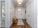 Inviting foyer with hardwood floors, a decorative rug, bench seating and board and batten accents at 815 Digby Rd, Rock Hill, SC 29730