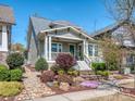 Stylish home with landscaped front yard, rock garden, attractive shrubs and a welcoming covered porch at 815 Digby Rd, Rock Hill, SC 29730