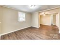Inviting living room with hardwood floors, neutral walls, and natural light from the window at 110 Steele St # 34 35, Fort Mill, SC 29715