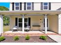 Inviting front porch with comfortable seating and meticulously maintained landscaping, offering curb appeal at 1308 Spring Lake Dr, Gastonia, NC 28054