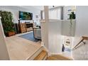 Bright living room with wood floors, modern decor, and large windows for plenty of natural light at 1651 Duckworth Ave, Charlotte, NC 28208