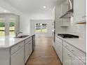 This kitchen showcases stainless steel appliances, including a gas range, and beautiful views of the outdoors at 2022 Puddle Pond Rd, Indian Trail, NC 28079