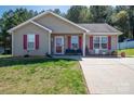 A cozy home with red shutters and a tidy front yard for sale at 2401 Gelsinger Ave, Bessemer City, NC 28016