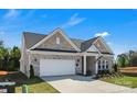 Lovely brick home with an attached garage and well-kept front yard at 3054 Constitution Ln, Gastonia, NC 28056