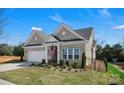 Beautiful home featuring manicured landscaping and a classic brick exterior at 3054 Constitution Ln, Gastonia, NC 28056