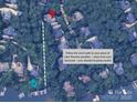 Aerial view of a property close to the lake with a path leading to deeded boat slip access at 4646 Eagle Pointe Ct, Denver, NC 28037