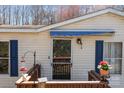 Close up of the home's front door that has a blue awning above it and a small porch at 4793 Appaloosa Ln, Maiden, NC 28650