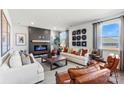 Open-concept living room featuring a modern fireplace and lots of natural light at 711 Olde England Dr, Lincolnton, NC 28092