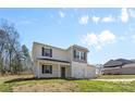 A two-story home showcasing light-colored siding, a three-car garage, and a well-maintained lawn at 109 Landon Ct, Shelby, NC 28152