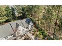 Aerial view of a lovely two-story townhome with mature trees and lush landscaping at 11929 Kings Castle Ct, Charlotte, NC 28277