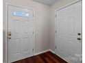 Inviting entryway featuring gleaming hardwood floors and white doors at 11929 Kings Castle Ct, Charlotte, NC 28277