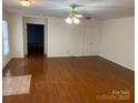 Spacious living room featuring hardwood floors and a ceiling fan at 139 Sain Rd, Statesville, NC 28625