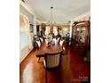 A beautifully appointed dining room featuring a long table and elegant chandelier at 16306 Hayfield Rd, Charlotte, NC 28213