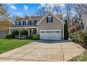 Charming two-story home features a two-car garage and a well-manicured lawn at 270 Almora Loop, Mooresville, NC 28115