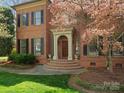 Inviting front entrance with brick steps and manicured landscaping at 3600 Castellaine Dr, Charlotte, NC 28226