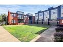 View of a brick multi-Gathering exterior with a well-manicured lawn at 474 New Bern Station Ct, Charlotte, NC 28209