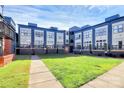 Multi-Gathering exterior features well-maintained lawn, outdoor patios at 474 New Bern Station Ct, Charlotte, NC 28209