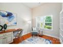 Cozy home office with natural light, hardwood floors, and comfortable seating for a productive workspace at 5032 Eagles Crest Ln, Gastonia, NC 28056