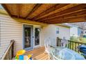 Covered deck perfect for outdoor dining and relaxation with clear sliding glass door at 87 Green Meadows Dr, Taylorsville, NC 28681