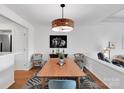 Elegant dining room featuring a modern pendant light and decorative rug, creating a stylish and inviting space at 9808 Emerald Point Dr # 10, Charlotte, NC 28278