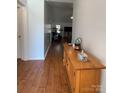 Inviting entryway with gleaming hardwood floors and stylish console table at 1015 Raywood Ct, Matthews, NC 28104