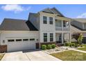 Lovely home with a two car garage, a cozy front porch, and a well-maintained lawn at 1274 Fishing Creek Rd # 134, Clover, SC 29710