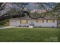 Inviting single-story home showcasing a well-maintained lawn and an attached garage for convenience at 1315 Vickie Ln, Matthews, NC 28104