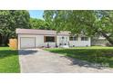 Inviting home with painted brick, new garage and shutters on a meticulously maintained lot and yard at 1315 Vickie Ln, Matthews, NC 28104