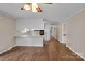 Bright living space with hardwood floors, white trim and a view into the kitchen at 3509 Havenwood Rd, Dallas, NC 28034