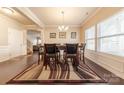 Elegant dining room with dark wood floors, perfect for hosting dinner parties at 3613 Martele Dr, Mint Hill, NC 28227