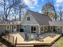 Expansive wooden deck with outdoor seating, perfect for entertaining in this beautiful home at 3647 Glen Haven Sw Dr, Concord, NC 28027