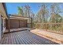Expansive wooden deck with stylish pergola overlooking a private yard at 3753 Capps Hill Dr, Charlotte, NC 28216