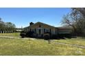 Single-story home with a chimney, front lawn, and a welcoming entrance at 4807 Lon Parker Rd # 1, Waxhaw, NC 28173