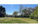 Landscaped front yard with a single story home, and vehicle parked in the driveway at 4807 Lon Parker Rd # 1, Waxhaw, NC 28173